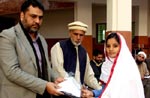 MWF Distributes books and uniforms among female students