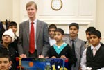 Boys from Minhaj Art School gift a painting to British MP 